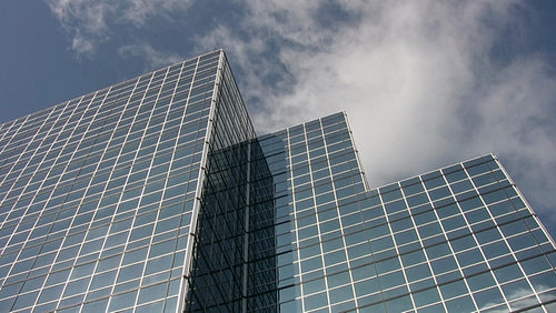 Mirrored office tower with three peaks. Real time clouds. Toronto, Canada. HDV footage. HD