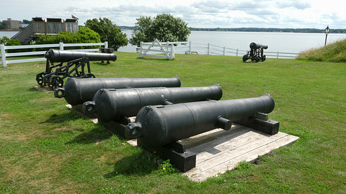 Old guns and gun barrels at Prince Edward Battery military site. Charlottetown, PEI. 4K.