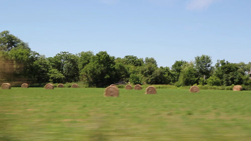 Rural drive. Hayfield in rural Ontario, Canada. HD video.