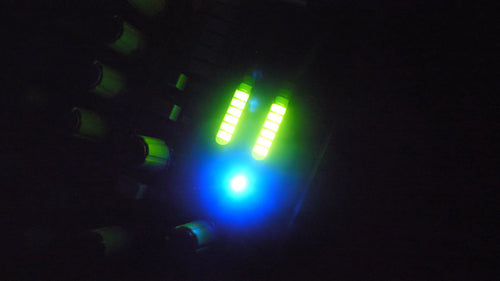 Defocused green and blue LED showing pumping sound levels. Music studio. HD.