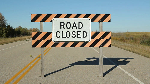 Road closed sign on abandoned road. Saskatchewan, Canada. HD.