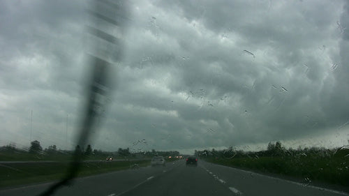 Highway driving with rain and stormclouds. Highway 416. Ontario, Canada. HD.