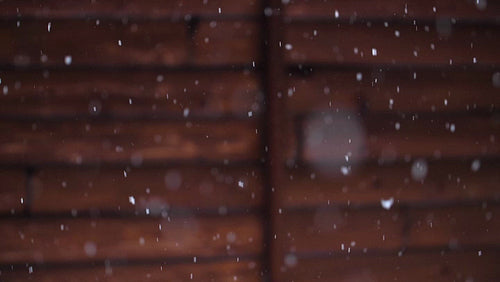 Winter snow with log cabin background. Slow motion snow falling. Winter in Canada. HD.