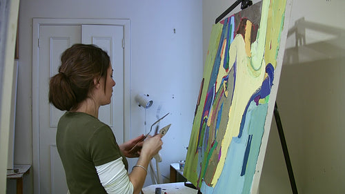 Artist working in the studio. Medium shot. HD video.