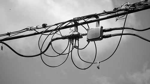 Suburban wires with television cable junction box. Black & white. Toronto, Ontario, Canada. HD.