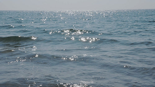 Two beautiful sunlit waves cresting and crashing. Slow motion. Lake Ontario. HD video.