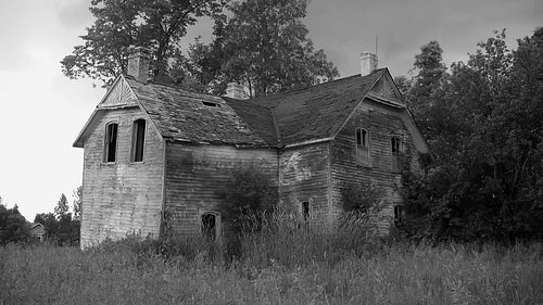 Haunted house. Abandoned farmhouse in rural Ontario. Black and white. HD.