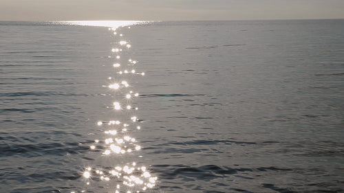 Slow motion lake with brilliant sun reflections. Shot from Toronto Islands. HD stock video.