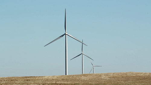 Three wind turbines in rural area. Manitoba, Canada. HD.