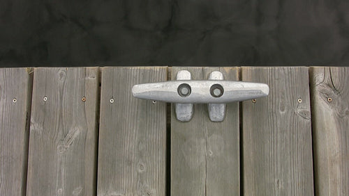 Cleat on wooden deck with water. Top down, horizontal view. HDV footage. HD.