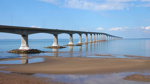 Confederation bridge with beach and traffic. New Brunswick, Canada. 4K.