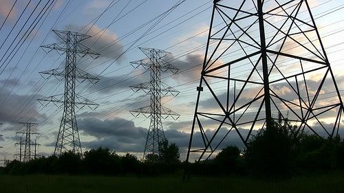 Hydro electric towers at sunset. Time lapse. Toronto, Ontario, Canada. HD.