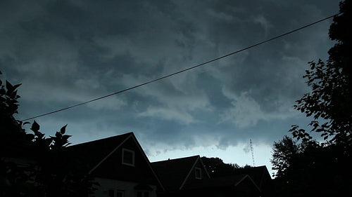 Scary looking storm clouds move over suburban neighbourhood. HD.