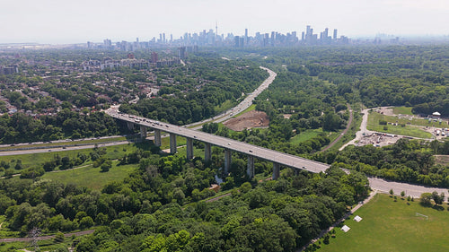 Drone flight over Leaside Bridge. DVP and downtown Toronto in the distance. 4K.