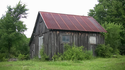 Wooden shed with tin roof in rural Ontario. HD.