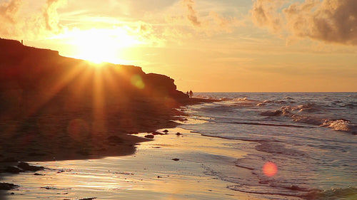 Golden beach sunset with people. Prince Edward Island, Canada. HD.