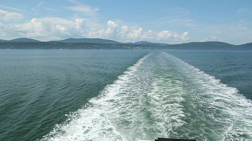 Ship wake on sunny day. St. Lawrence river, Quebec. HD.