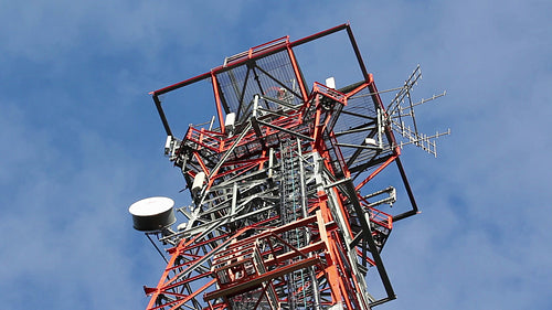 Red and white communication tower. Detail. HD.