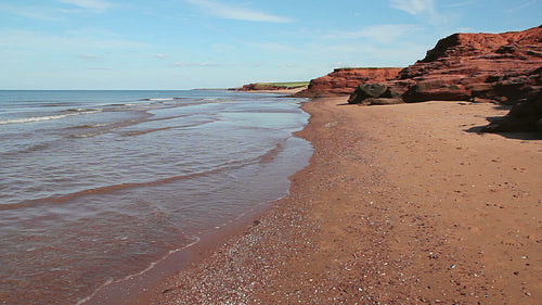 Prince Edward Island beach. Wide. Waves lapping. HD.