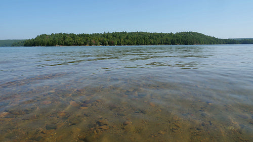 Clear lake water in cottage country. Haliburton, Ontario, Canada. 4K.