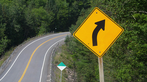 Corner road sign with highway. Summer driving in Ontario, Canada. 4K.