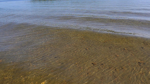 Clear lake water in slow motion. Summer in cottage country. Ontario. HD