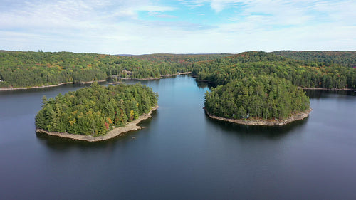 Drone flight between cottage islands on Redstone Lake, Haliburton. 4K.